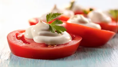 Tomato Slices Topped With Cream Cheese And Parsley