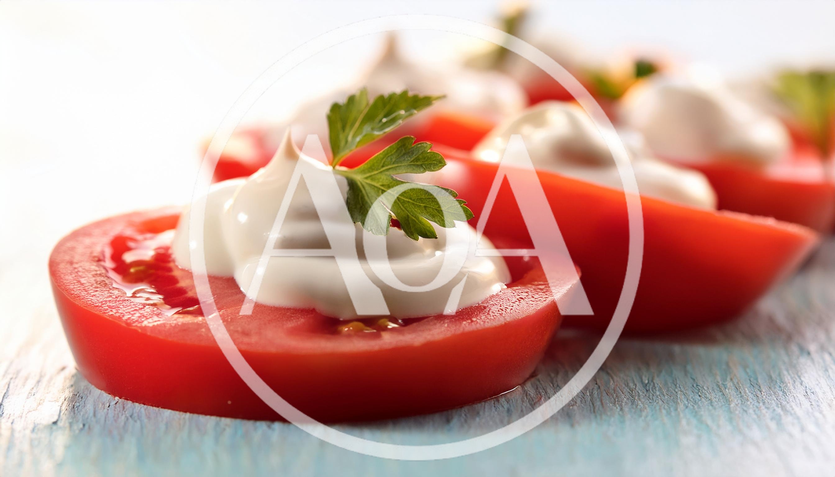 Tomato Slices Topped With Cream Cheese And Parsley