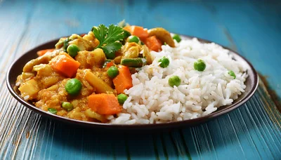 Vegetable Curry With Steamed White Rice On Plate