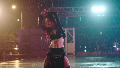 Woman Dancing In The Rain At Night