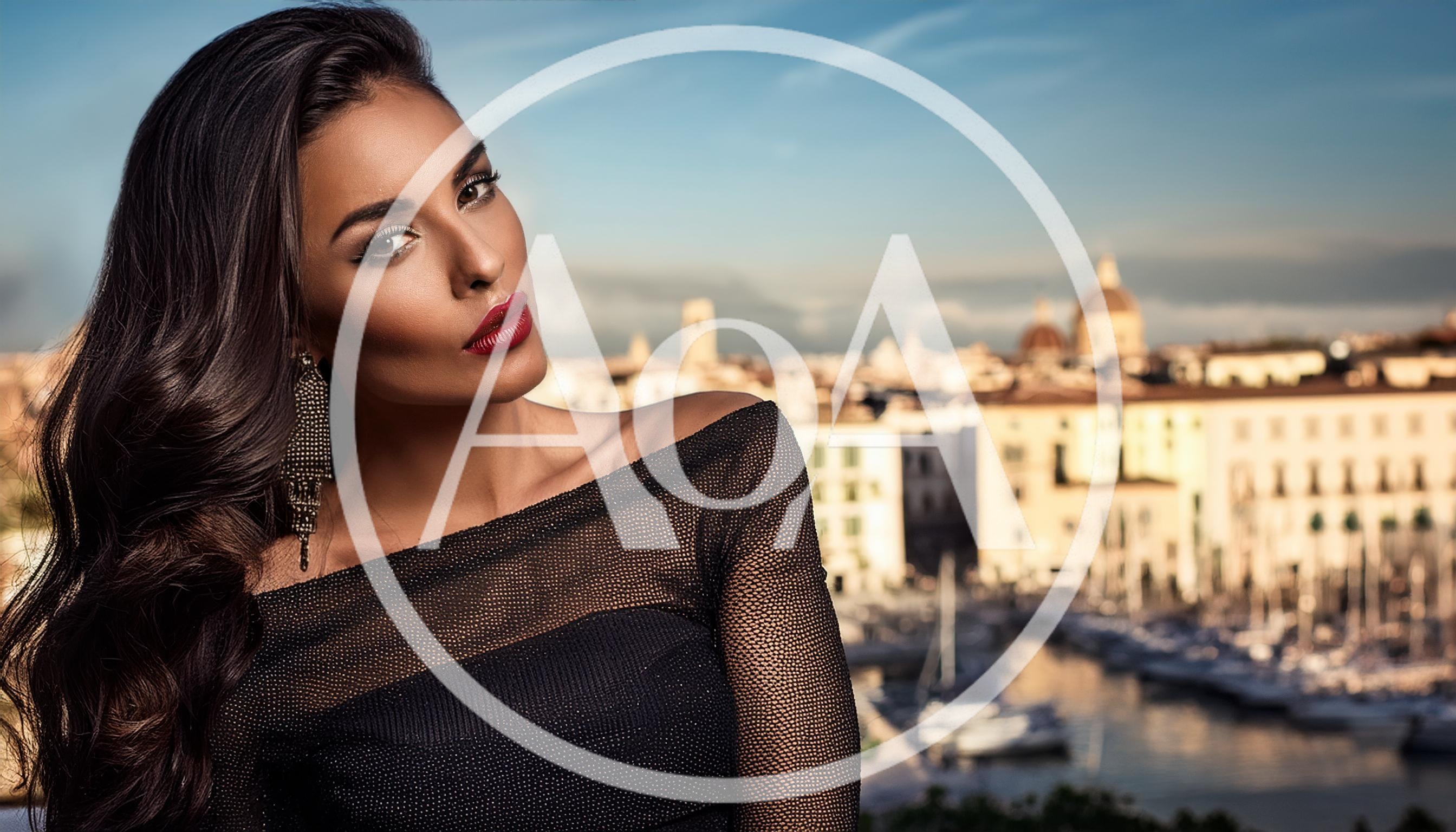 Glamorous Woman Posing Against A Mediterranean Cityscape