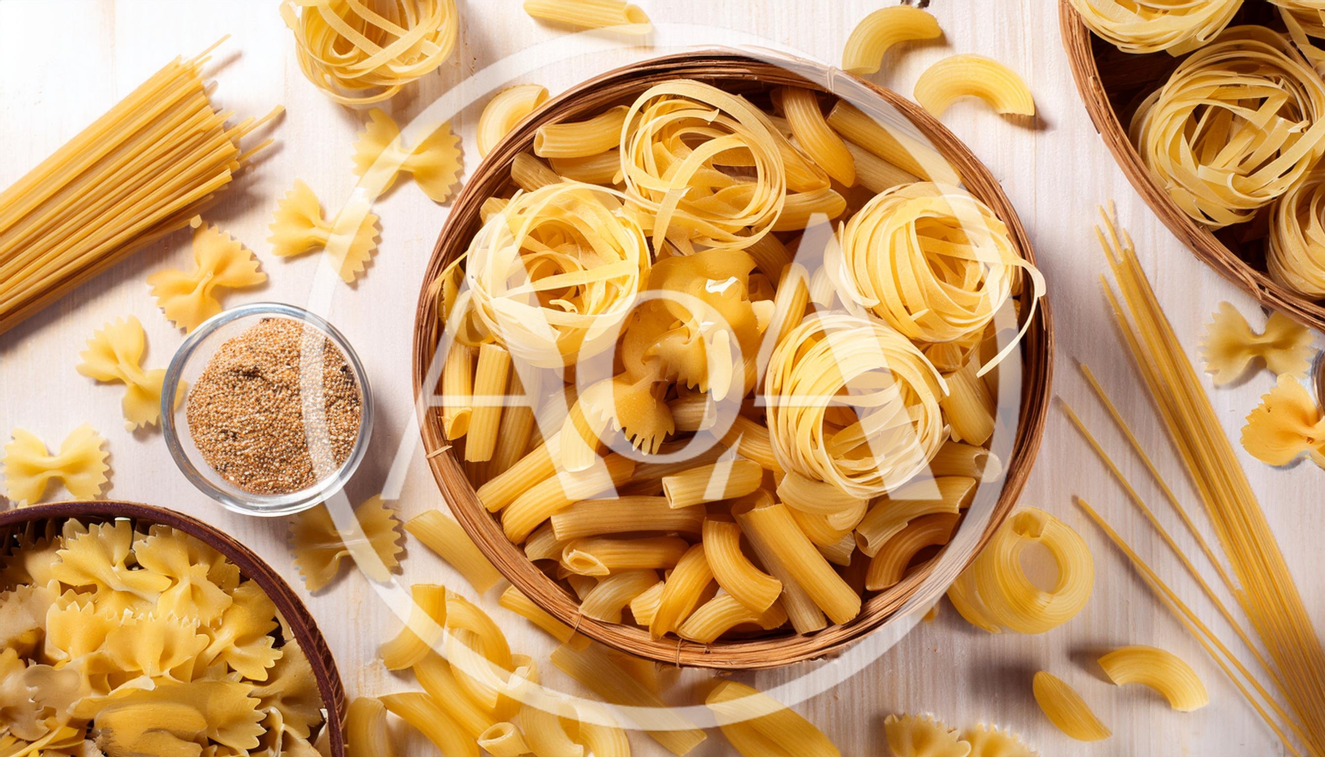 Assorted Dry Pasta Varieties On Wooden Surface