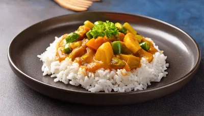 Vegetable Curry Served Over Steamed White Rice