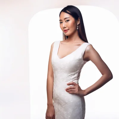 Elegant Asian Woman Posing In White Lace Dress