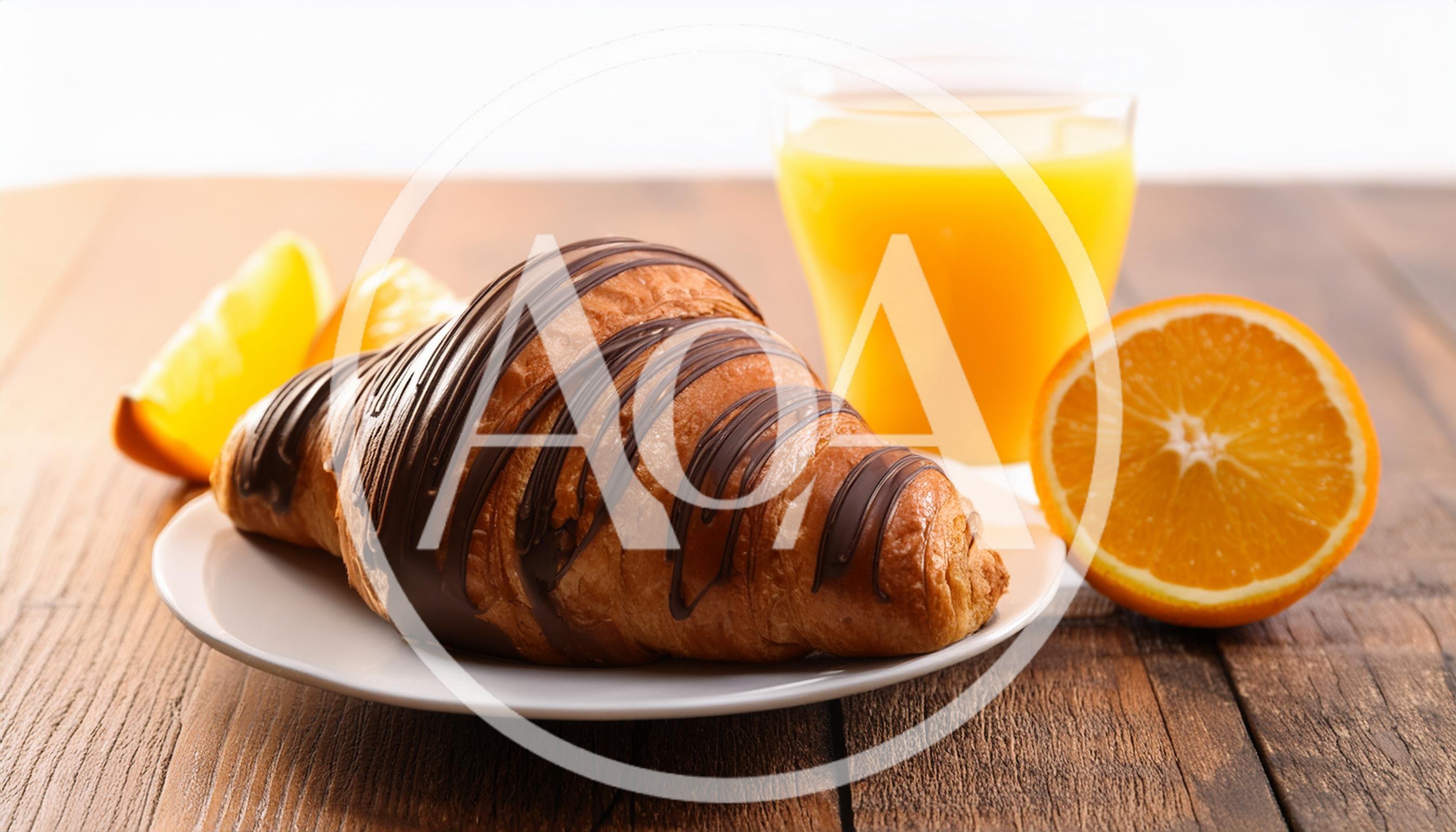 Chocolate Drizzled Croissant With Orange Juice And Slices