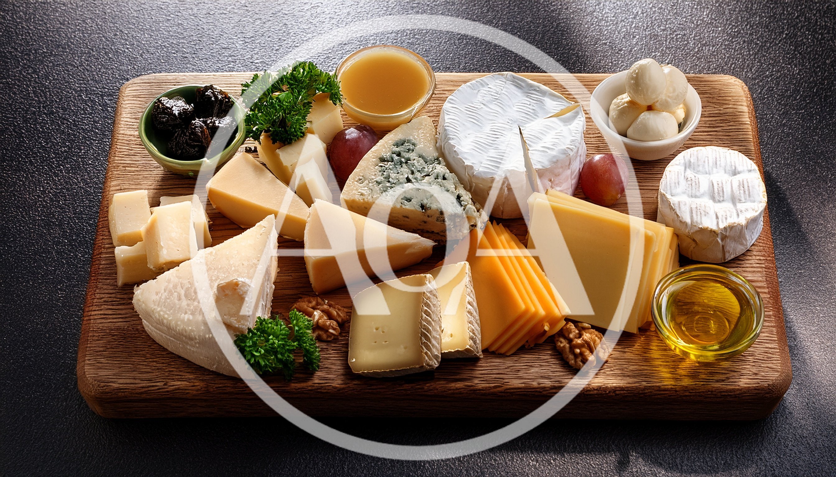 Gourmet Cheese Board With Assorted Cheeses And Accompaniments