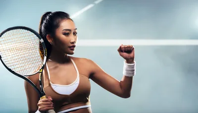 Female Tennis Player Celebrating Victory On Court
