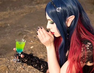 Fantasy Elf Woman Holding A Glowing Green Potion