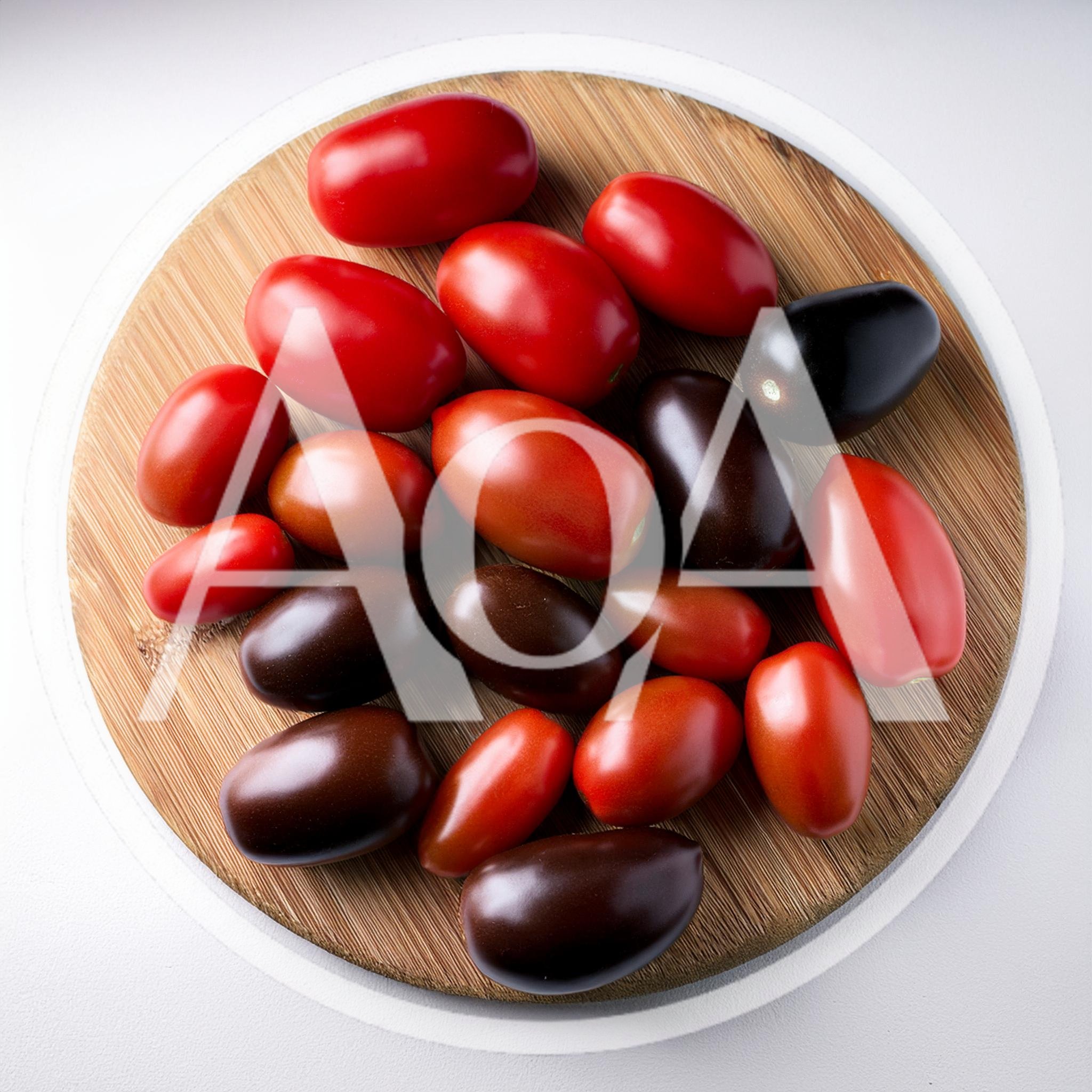 Assorted Fresh Heirloom Tomatoes on Wooden Cutting Board