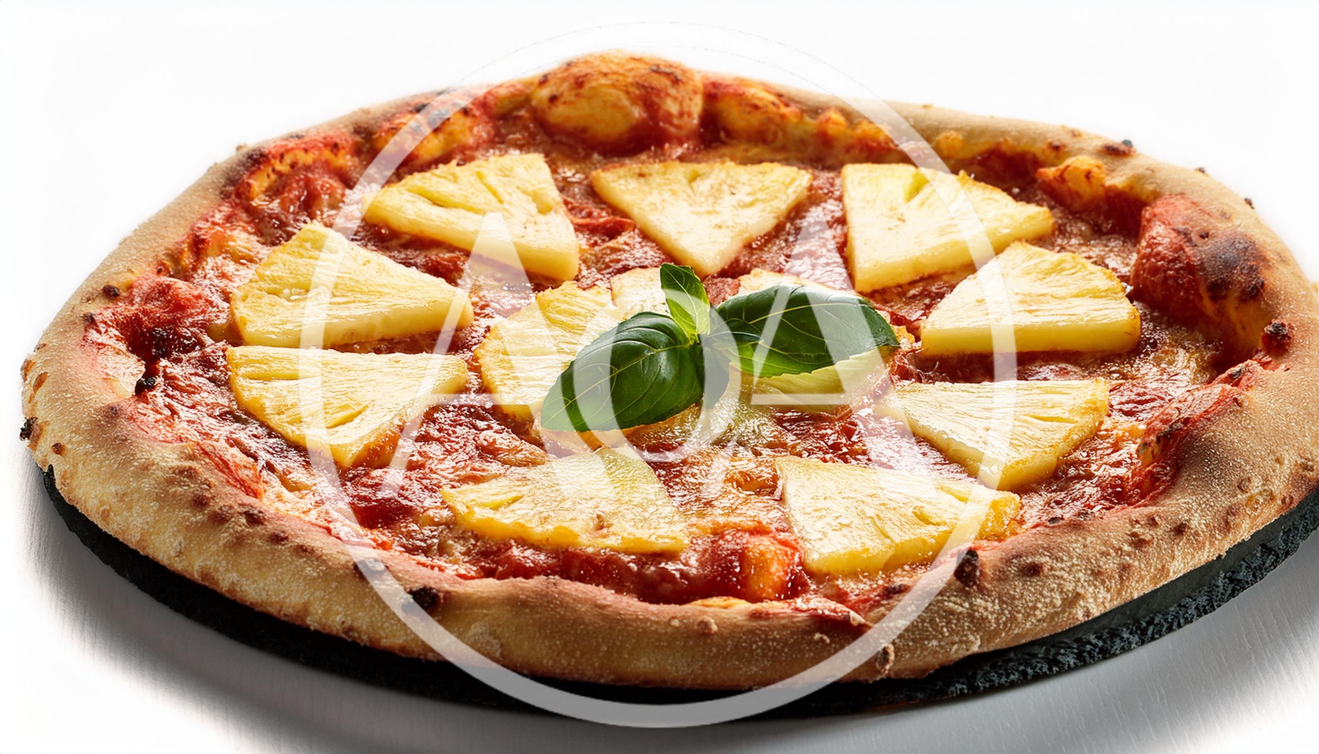 Fresh Pineapple Pizza With Basil Leaves On Dark Board