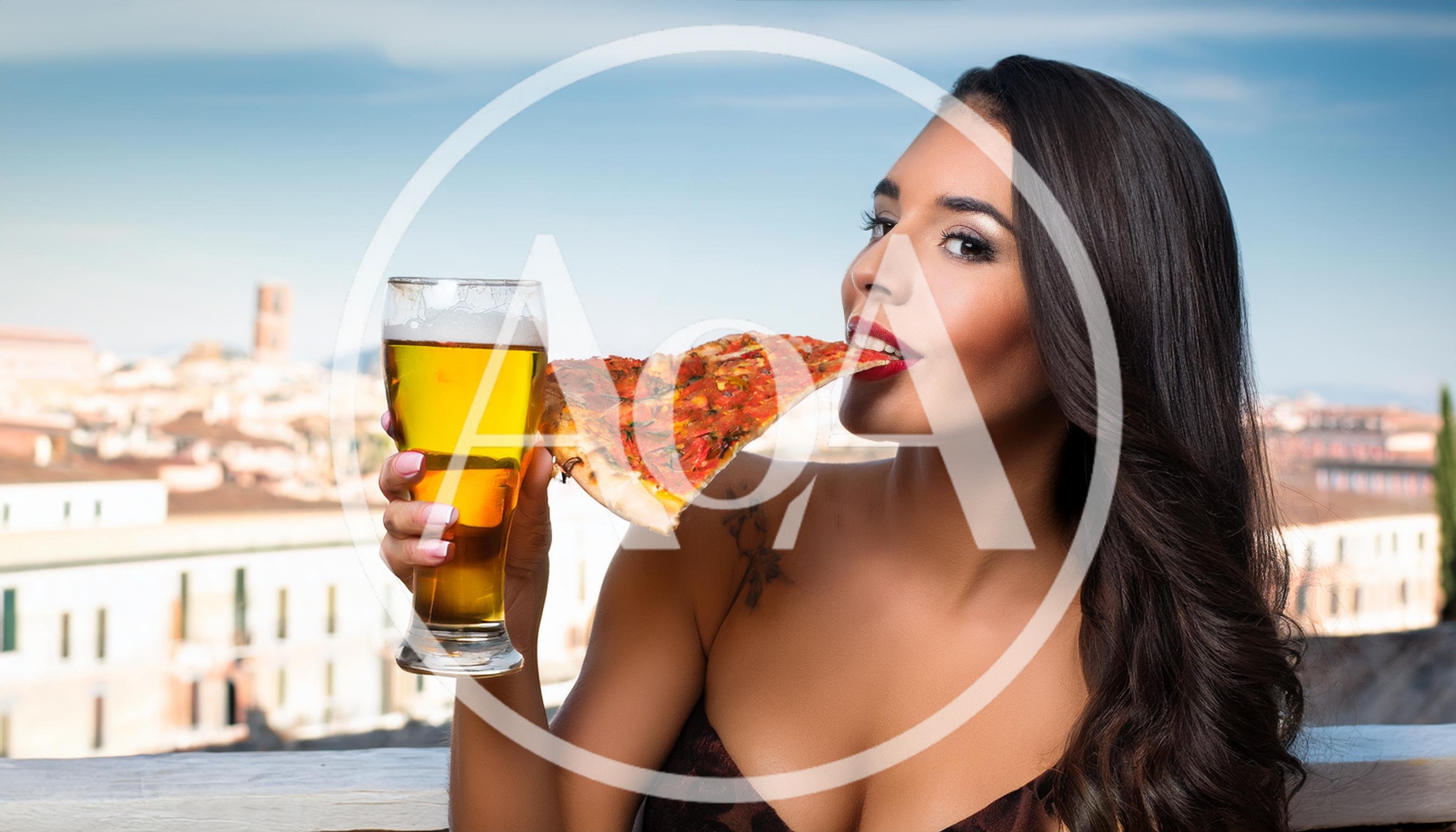Beautiful Woman Eating Pizza And Drinking Beer Outdoors