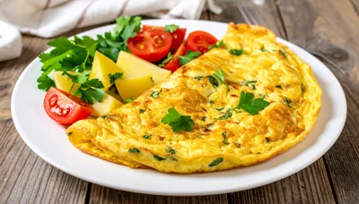 Omelet with Fresh Parsley and Tomatoes on a Plate
