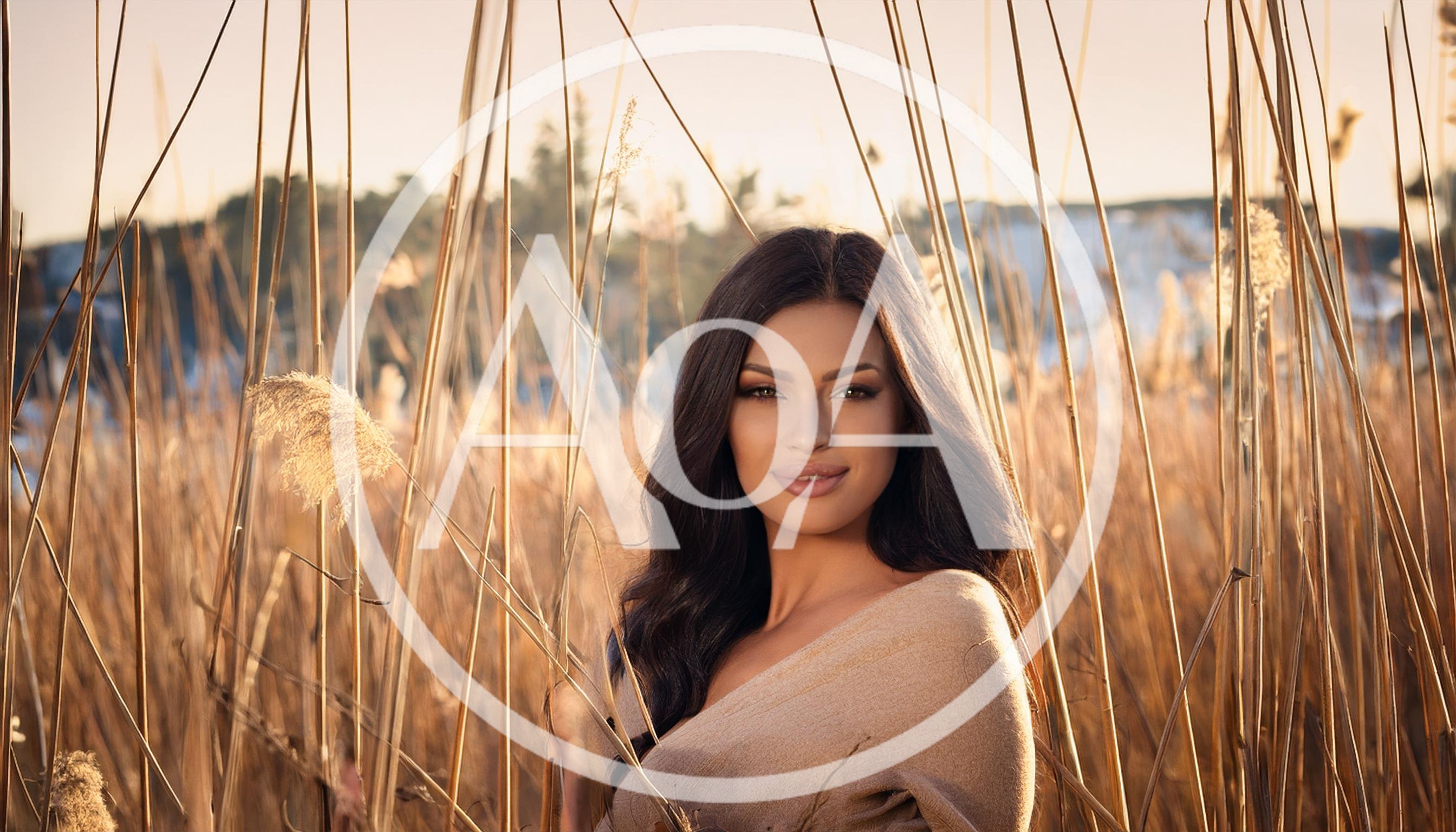 Portrait Of A Beautiful Woman In Tall Grass