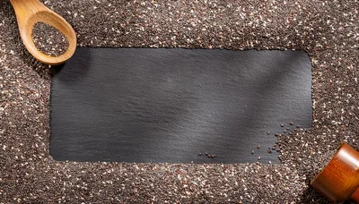 Chia Seeds Bordering A Dark Slate Background