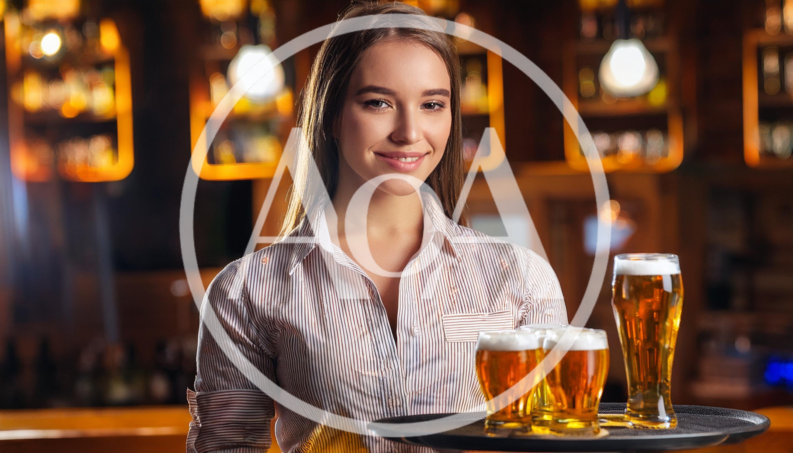 Smiling Waitress Holding A Tray Of Beer Glasses
