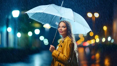 Young Woman Holding Umbrella Under Night Rain