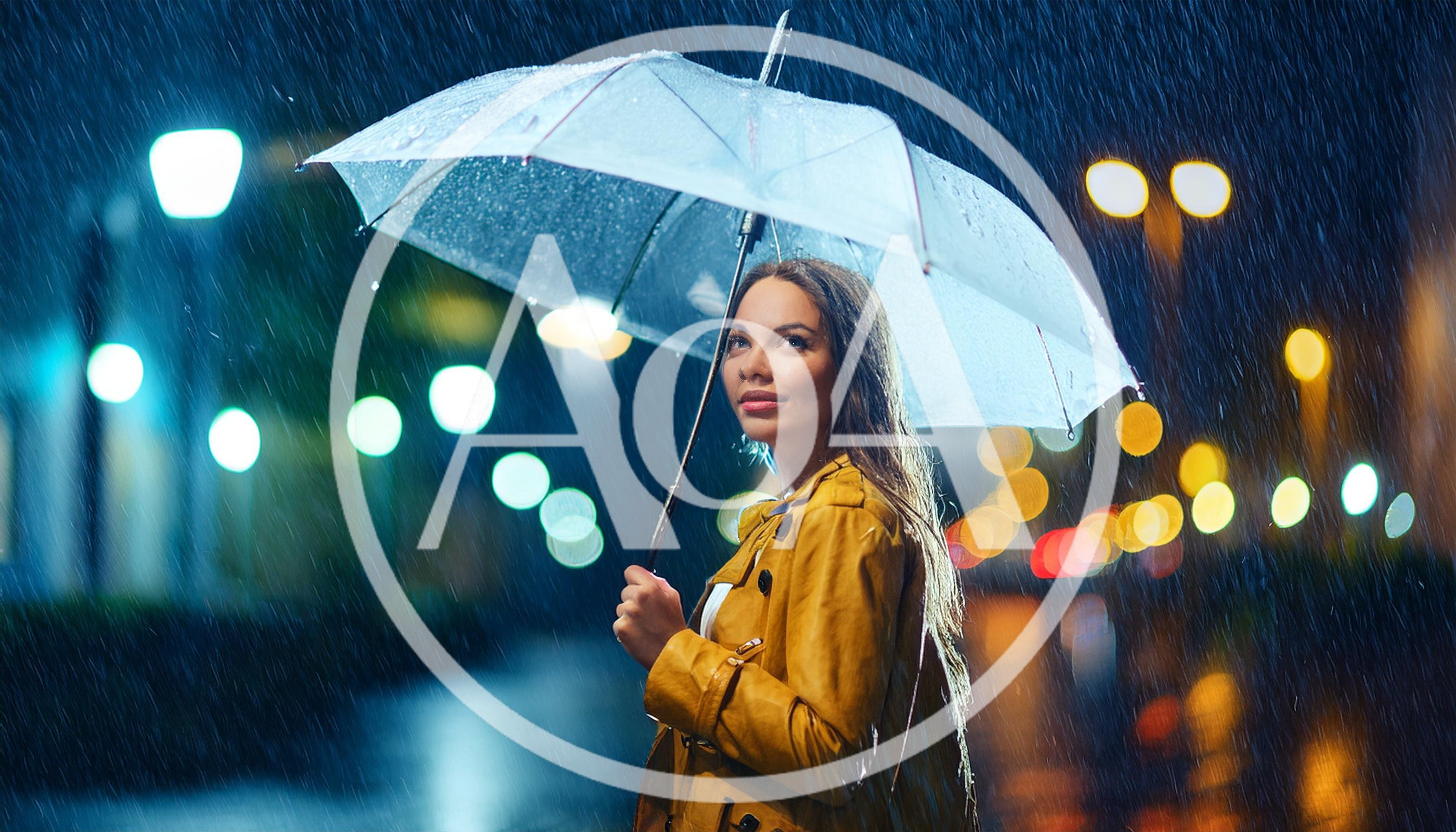 Young Woman Holding Umbrella Under Night Rain