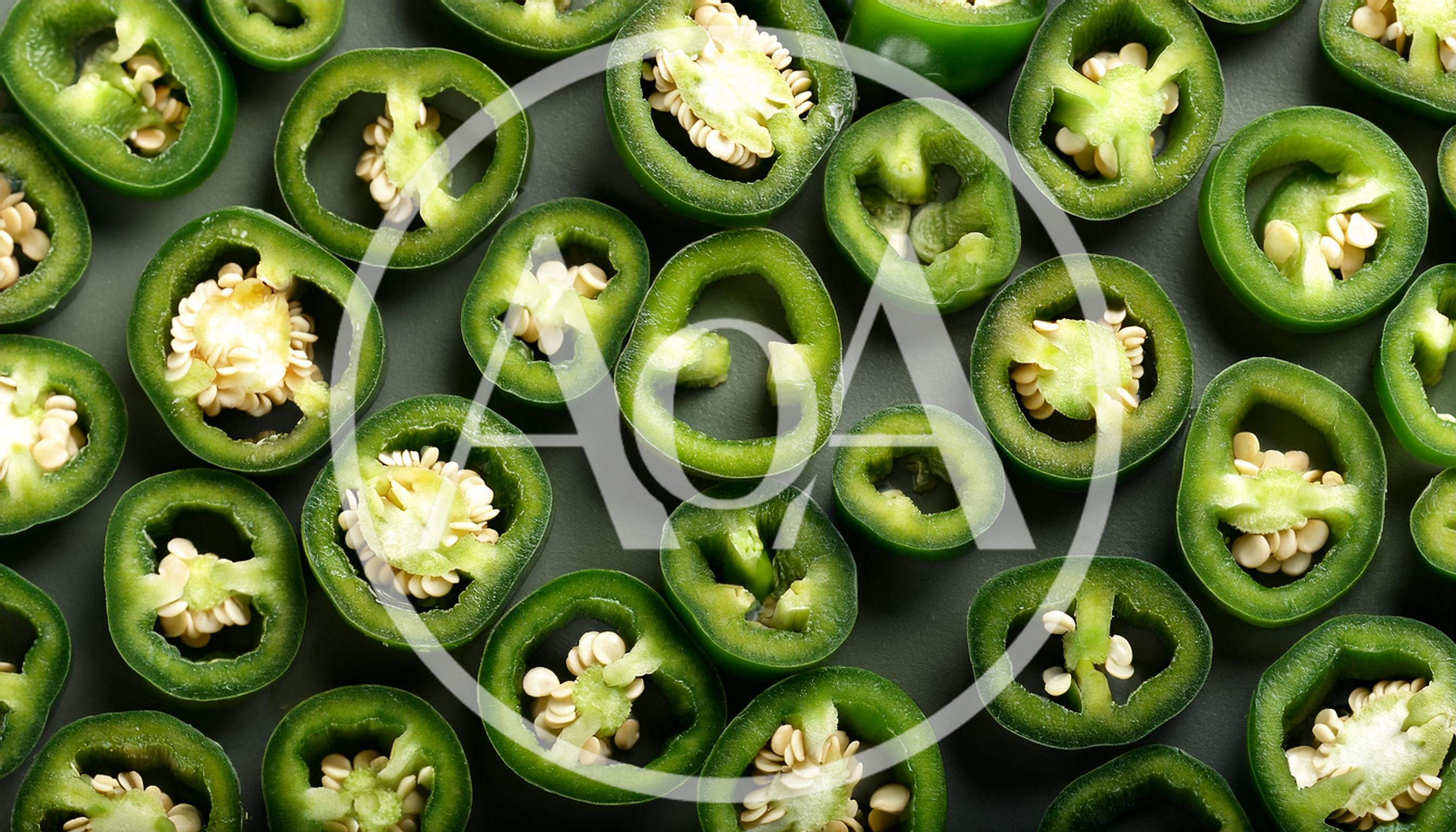 Fresh Sliced Jalapeno Peppers On Dark Background