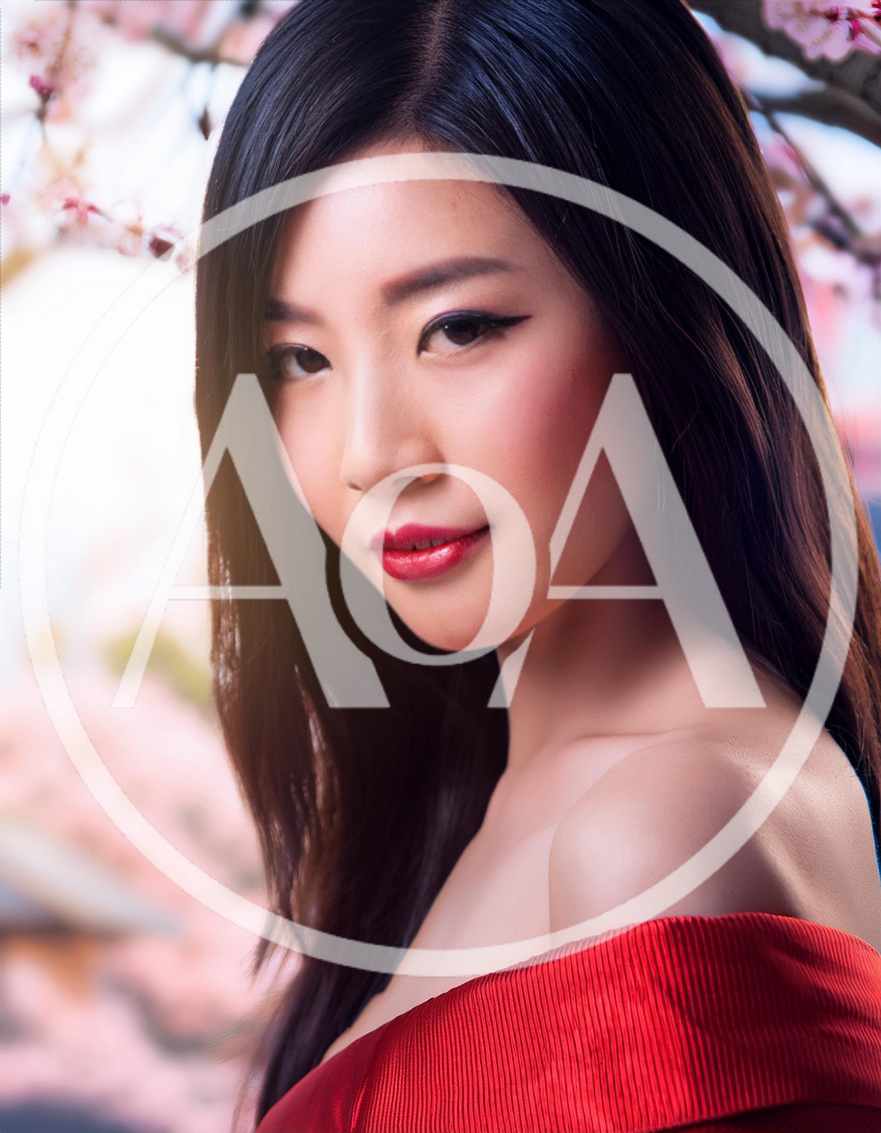 Portrait Of A Beautiful Young Asian Woman In Red