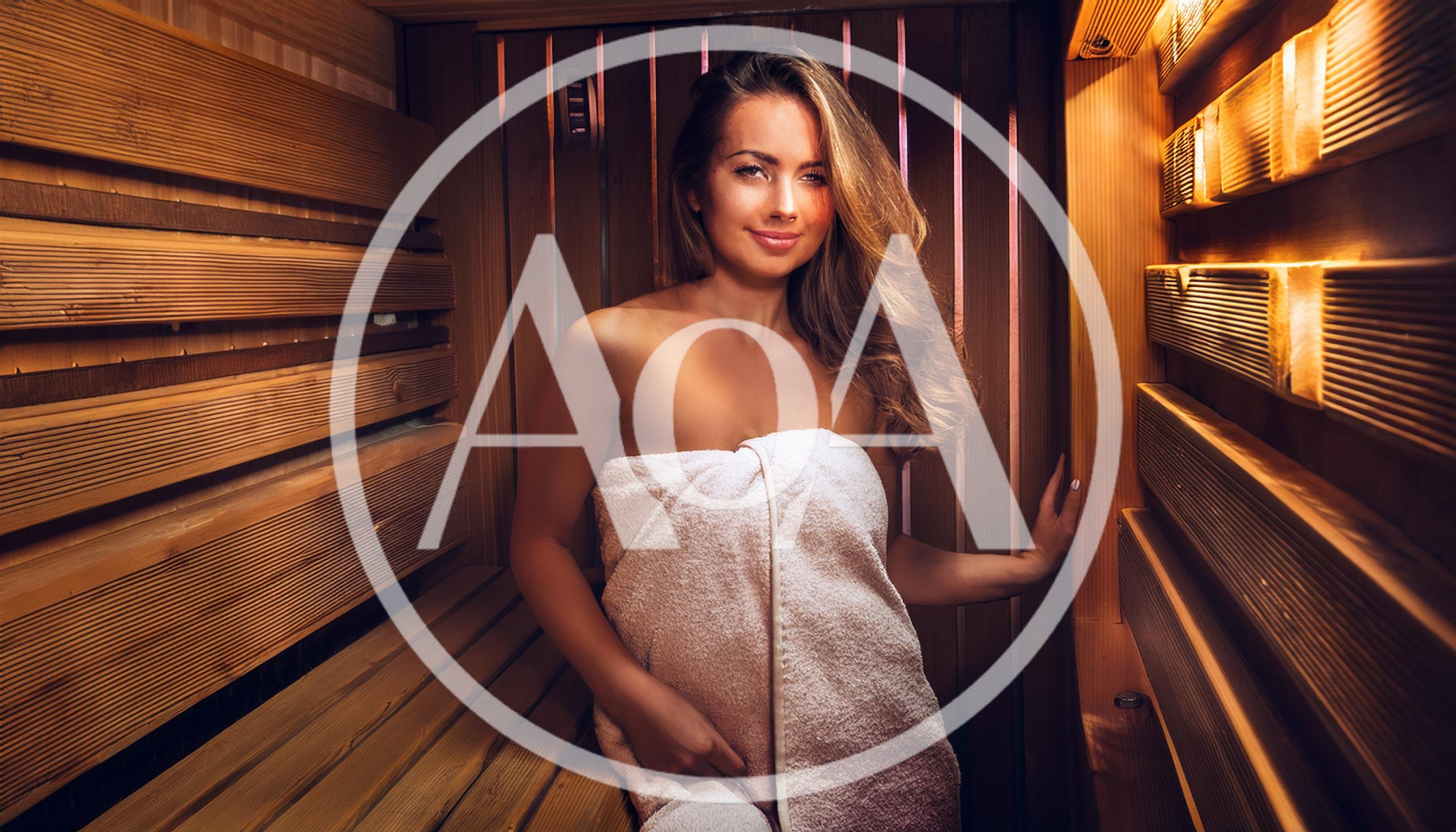 Beautiful Woman Relaxing In A Wooden Sauna