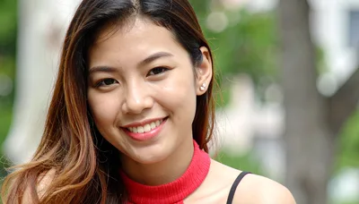 Portrait Of A Smiling Young Asian Woman