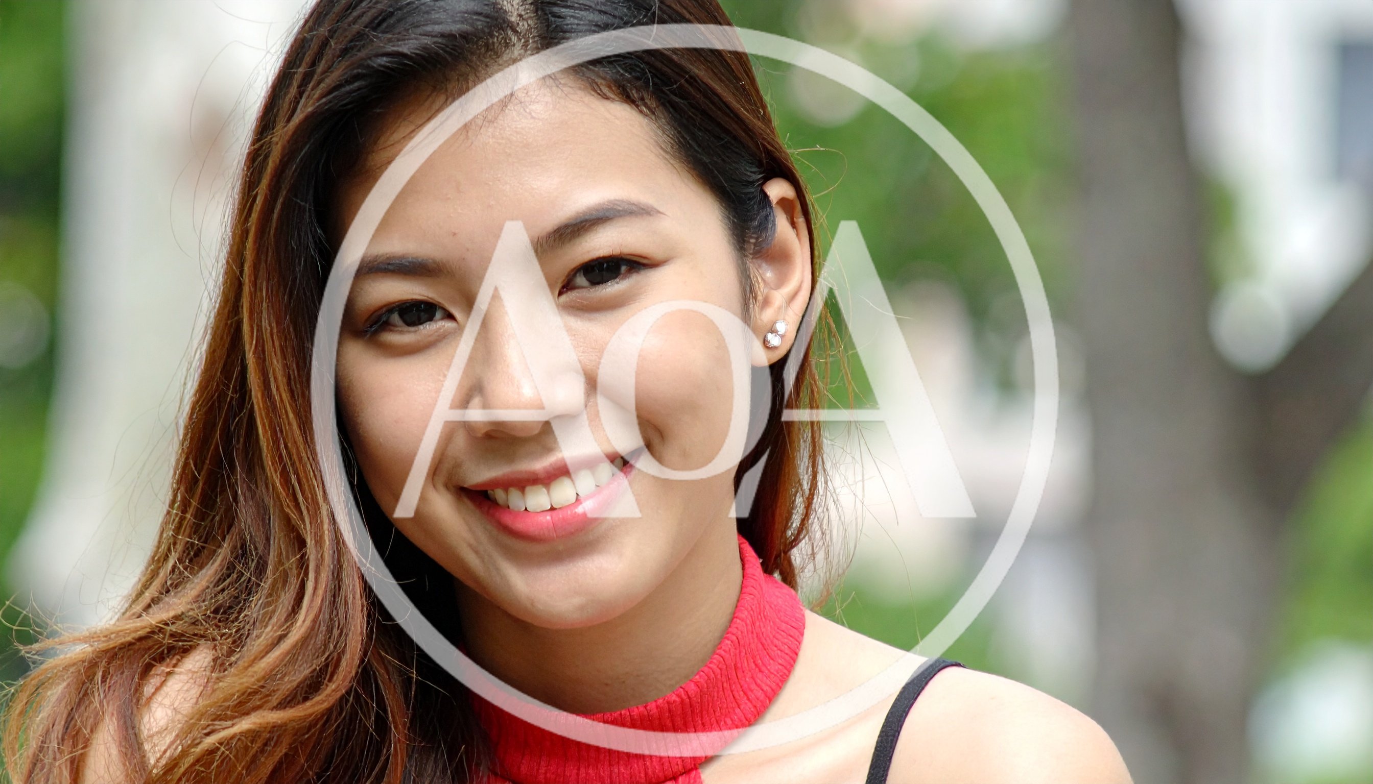 Portrait Of A Smiling Young Asian Woman