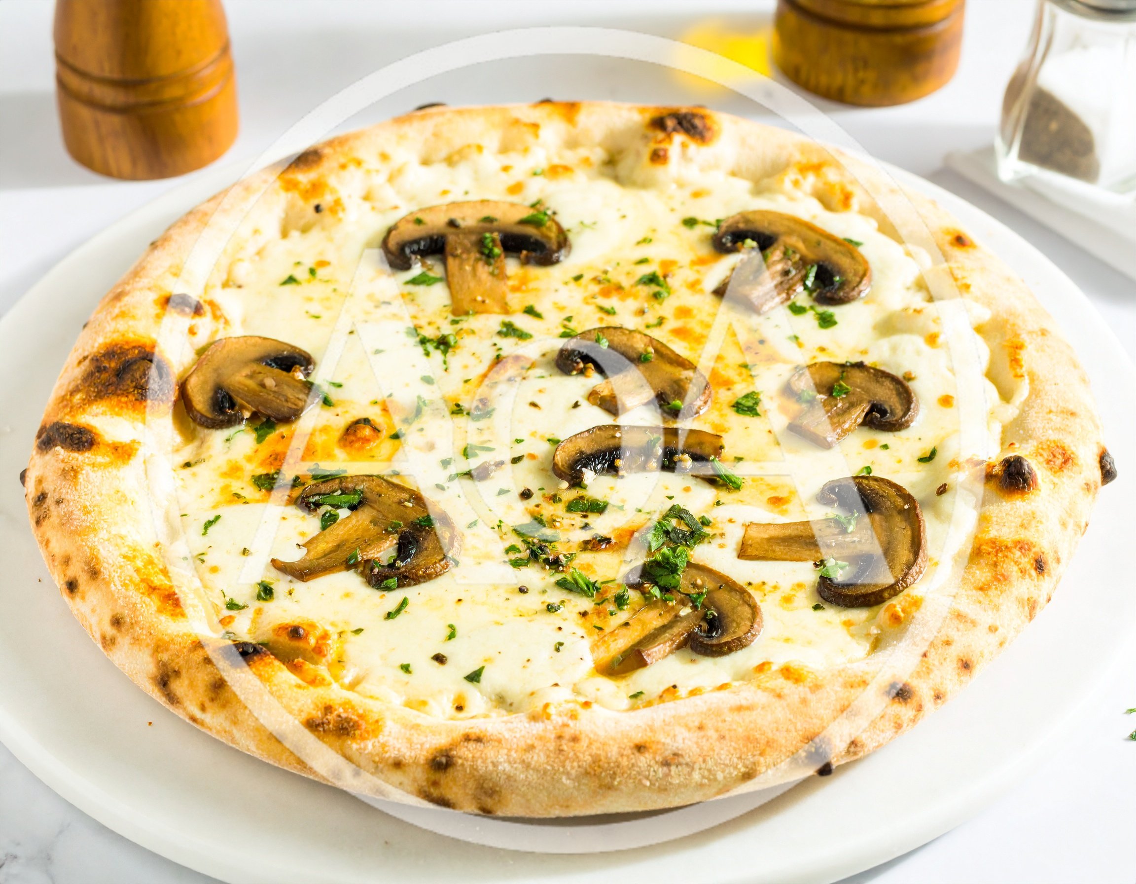 Freshly Baked Mushroom Pizza On A White Plate