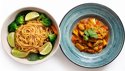 Two Bowls Of Asian Inspired Noodle And Curry Dishes