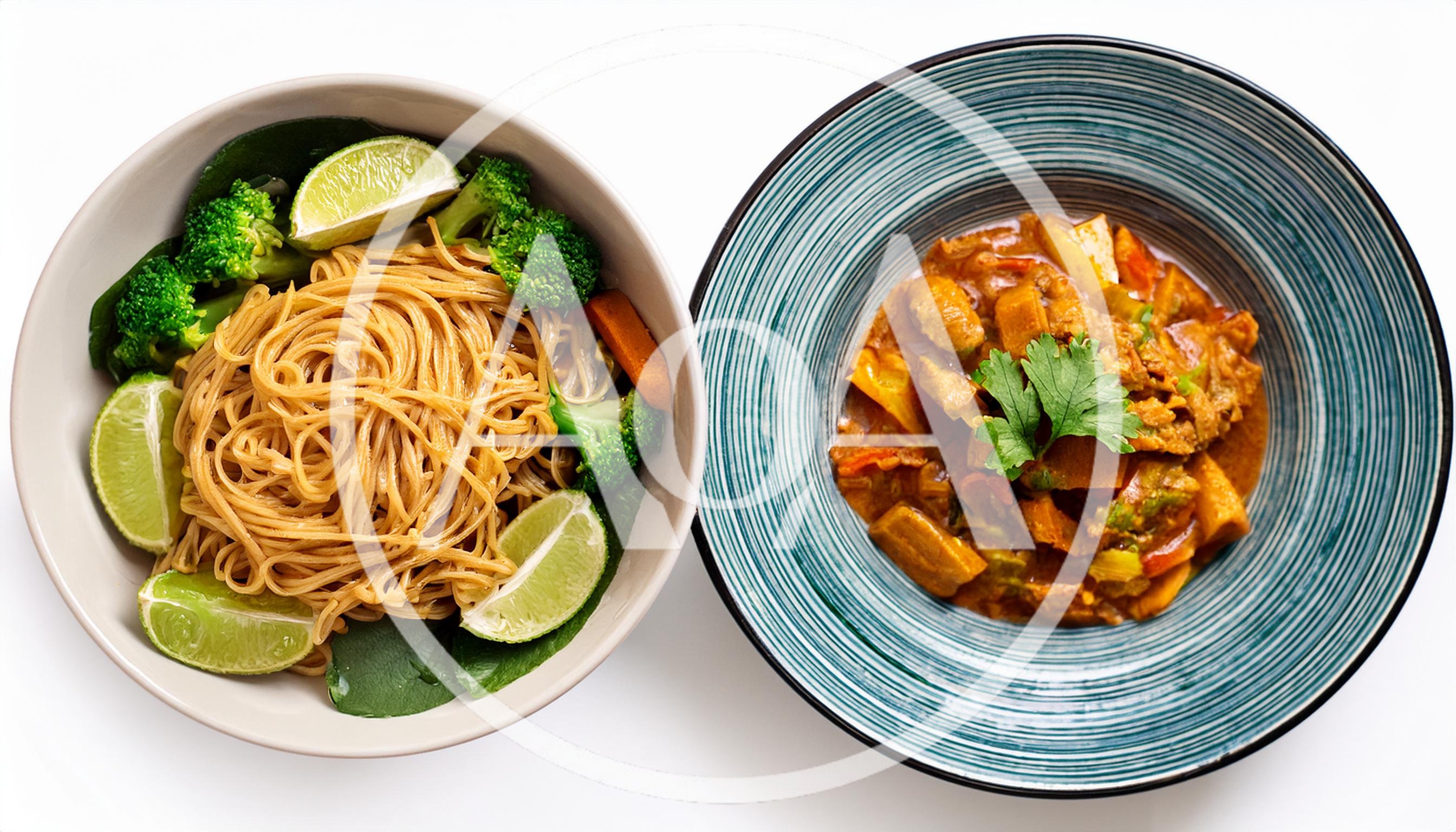 Two Bowls Of Asian Inspired Noodle And Curry Dishes