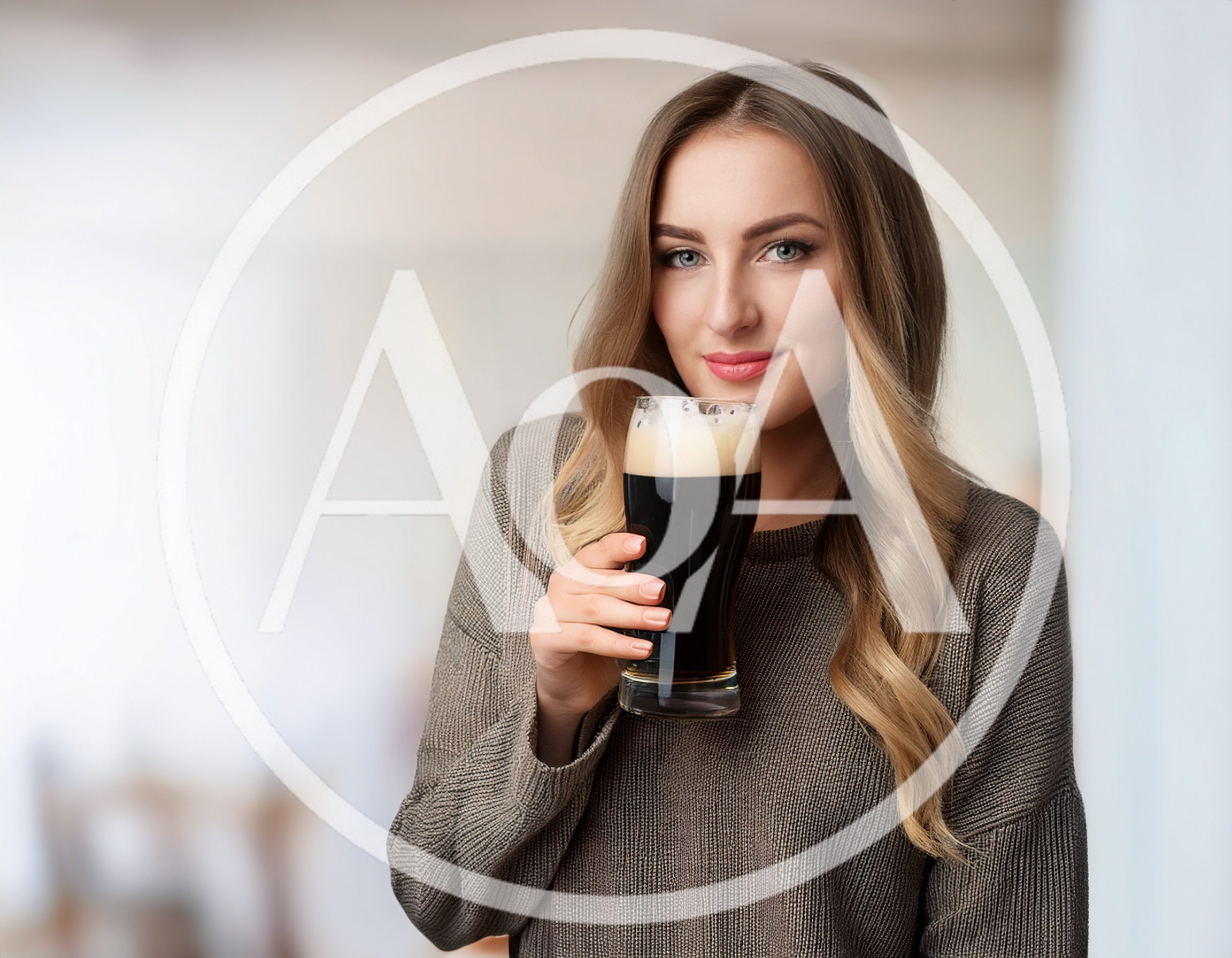 Young Woman Holding A Glass Of Dark Beer