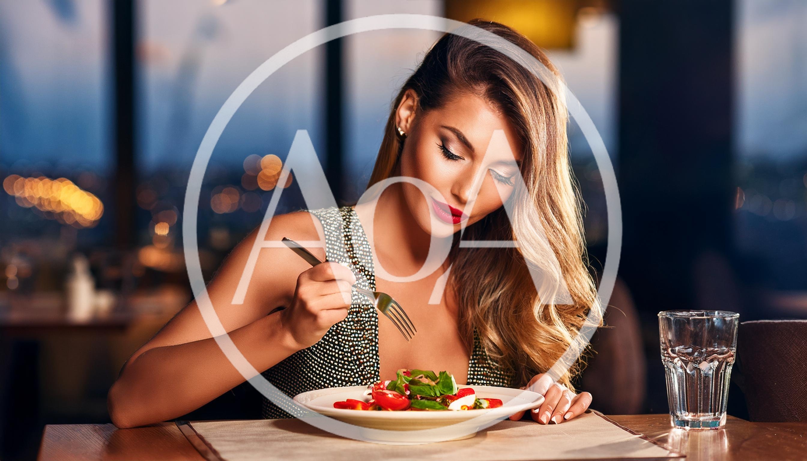 Elegant Woman Eating Fresh Salad In Upscale Restaurant