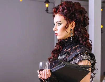Gothic Woman Holding Wine Glass and Book