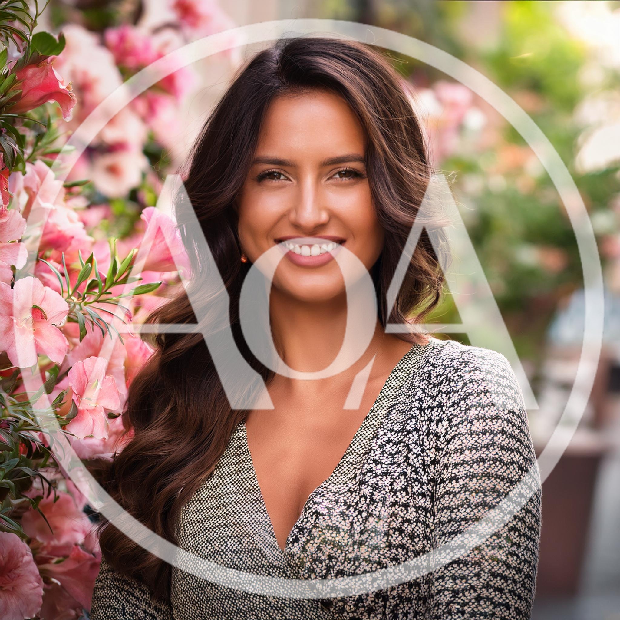 Portrait Of A Smiling Woman Beside Pink Flowers
