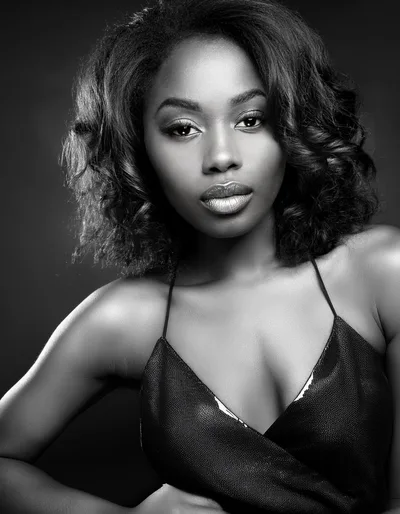 Portrait Of A Beautiful Young Woman In Black Dress
