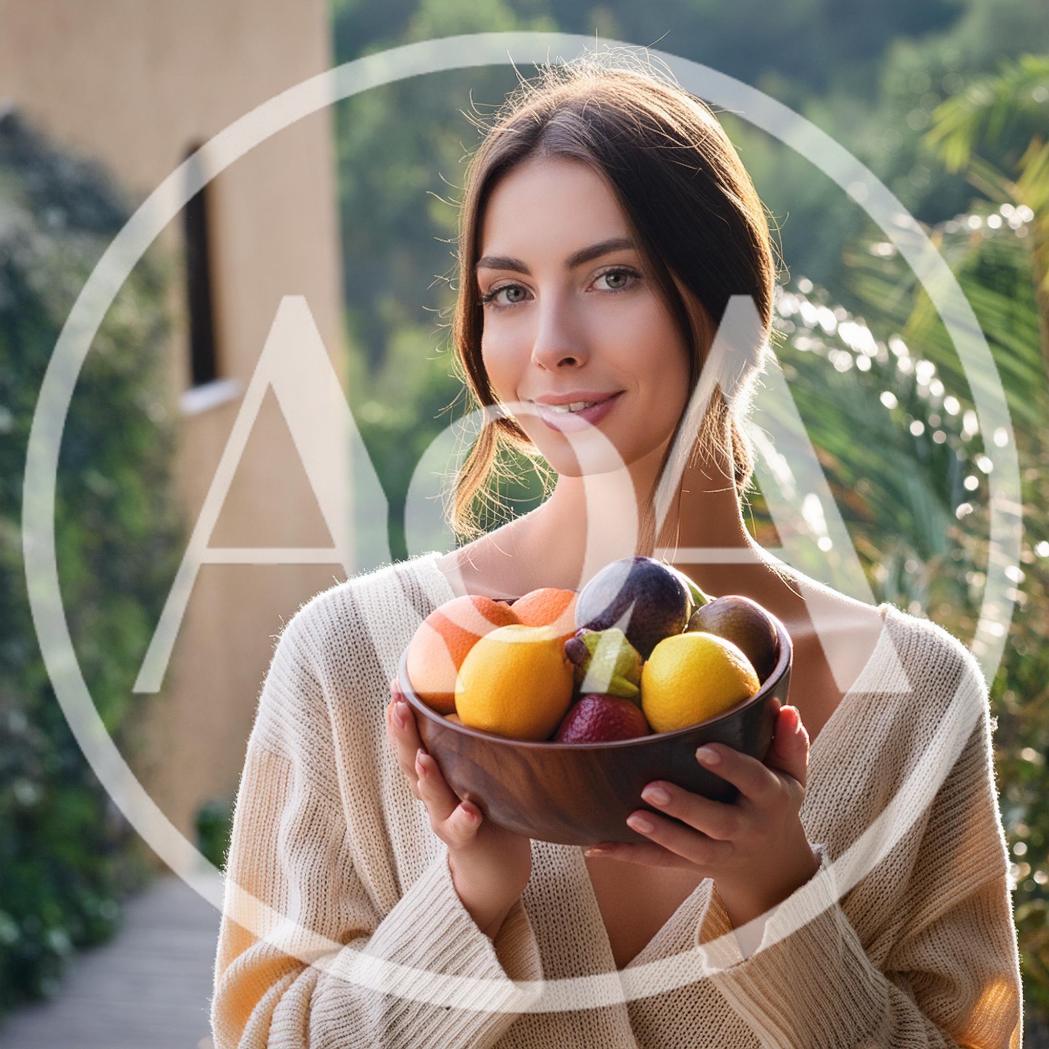 Young Woman Holding A Bowl Of Fresh Fruit