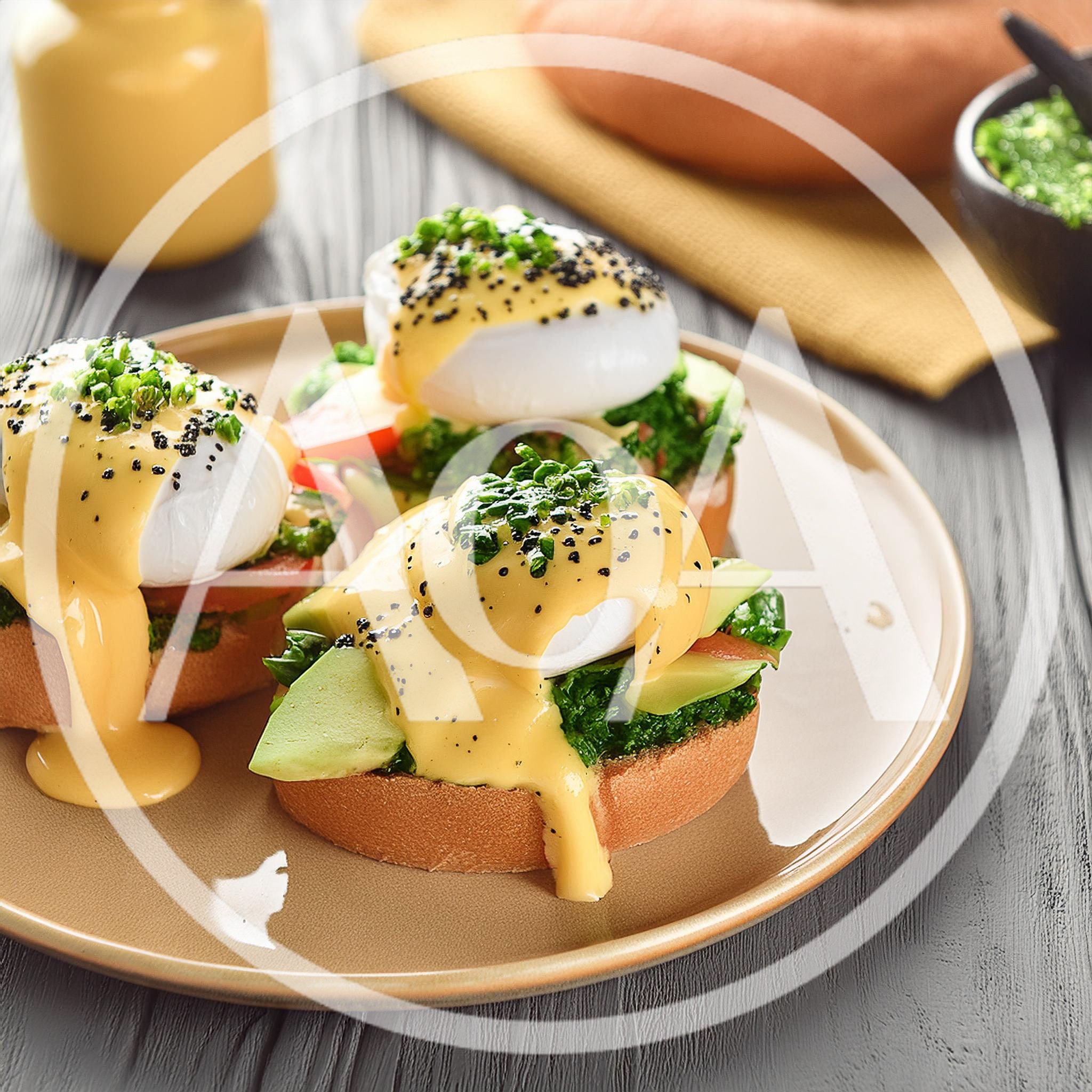 Gourmet Eggs Benedict With Avocado And Greens