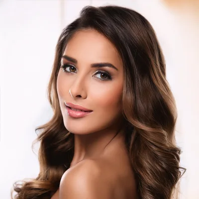 Portrait Of A Beautiful Woman With Wavy Brown Hair