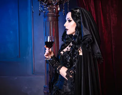 Gothic Woman Holding A Glass Of Red Wine