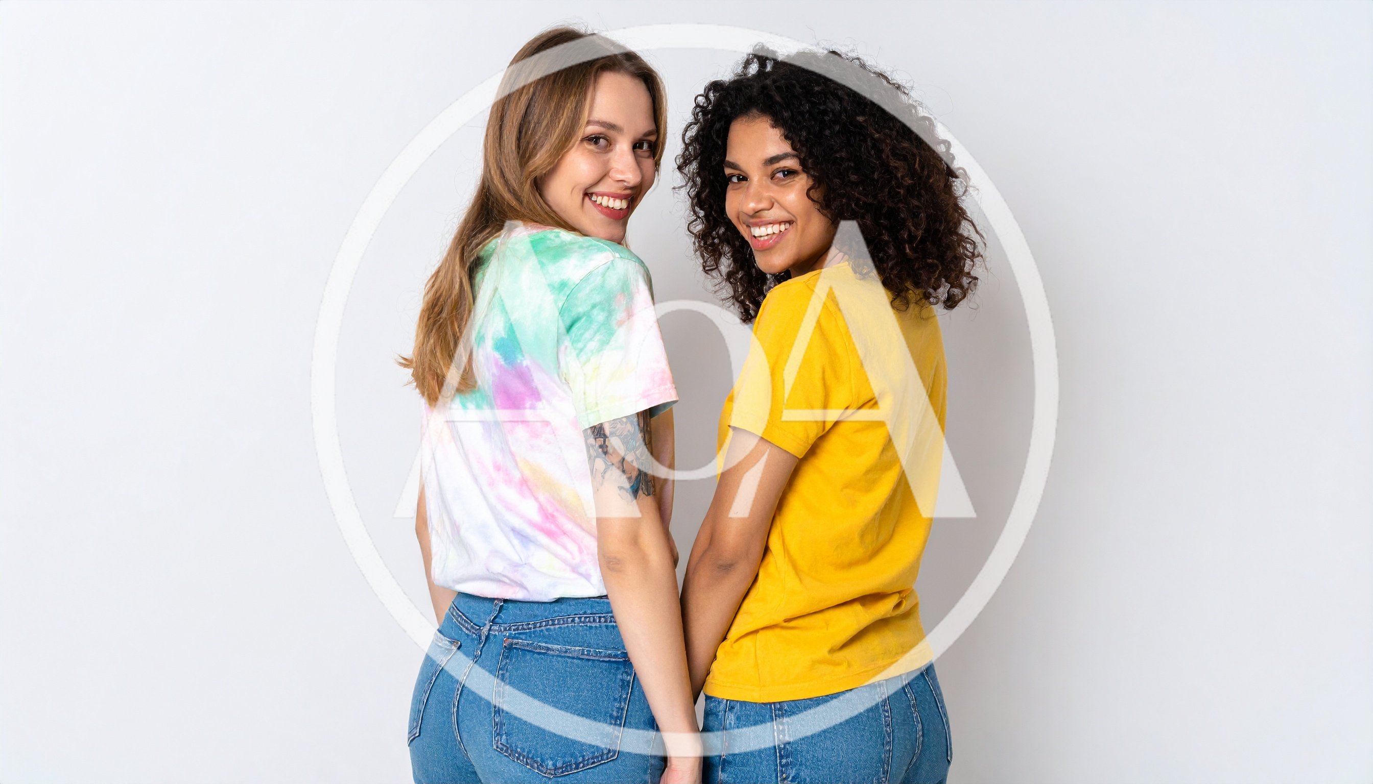 Two Diverse Young Women Smiling Back at Camera