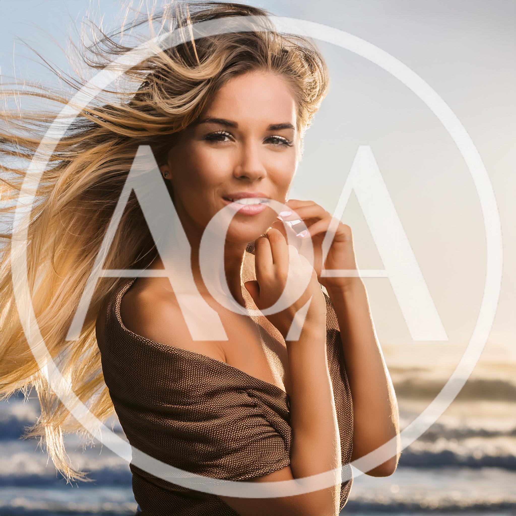 Beautiful Woman With Flowing Hair On Beach