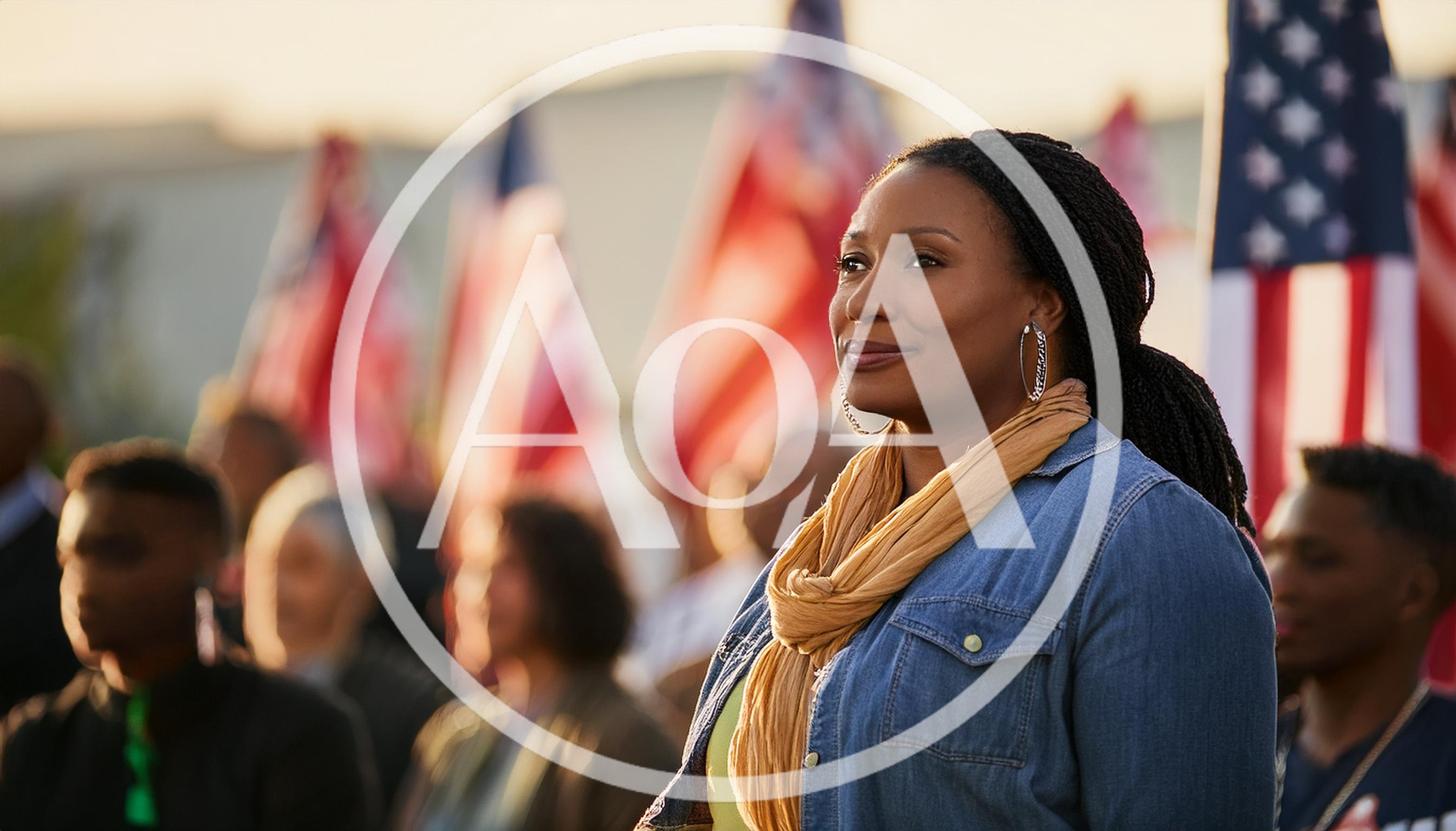 African American Woman Standing Outdoors With American Flags