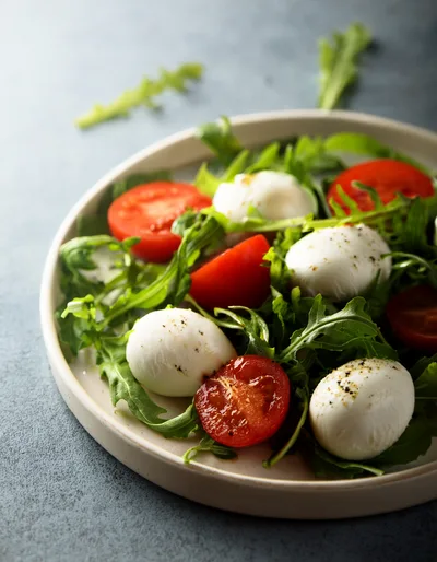Fresh Caprese Salad With Mozzarella And Arugula