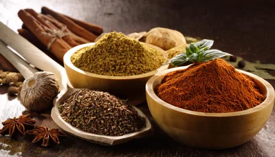 Assorted Spices and Herbs in Wooden Bowls