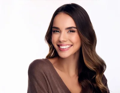 Portrait Of A Smiling Young Woman With Wavy Hair