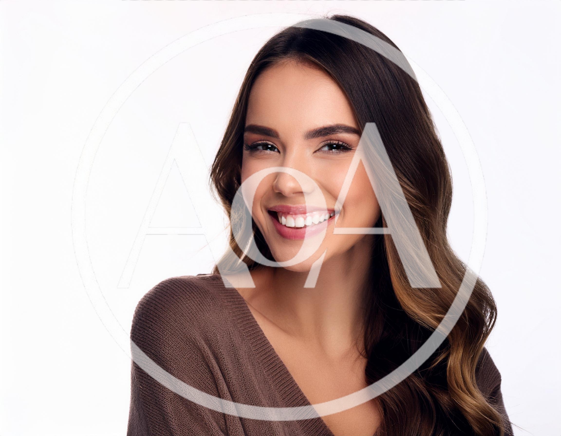 Portrait Of A Smiling Young Woman With Wavy Hair