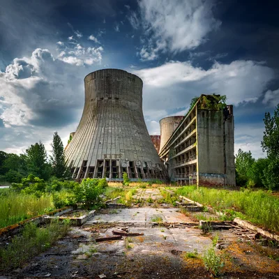 Abandoned Cooling Tower And Dilapidated Industrial Building