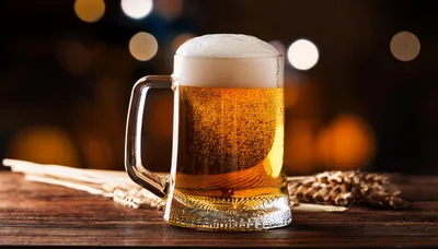Glass Mug Of Golden Beer With Wheat Stalks