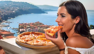 Young Woman Eating Pizza Overlooking Coastal Italian Town