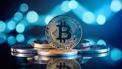 Bitcoin Cryptocurrency Coin On Reflective Surface