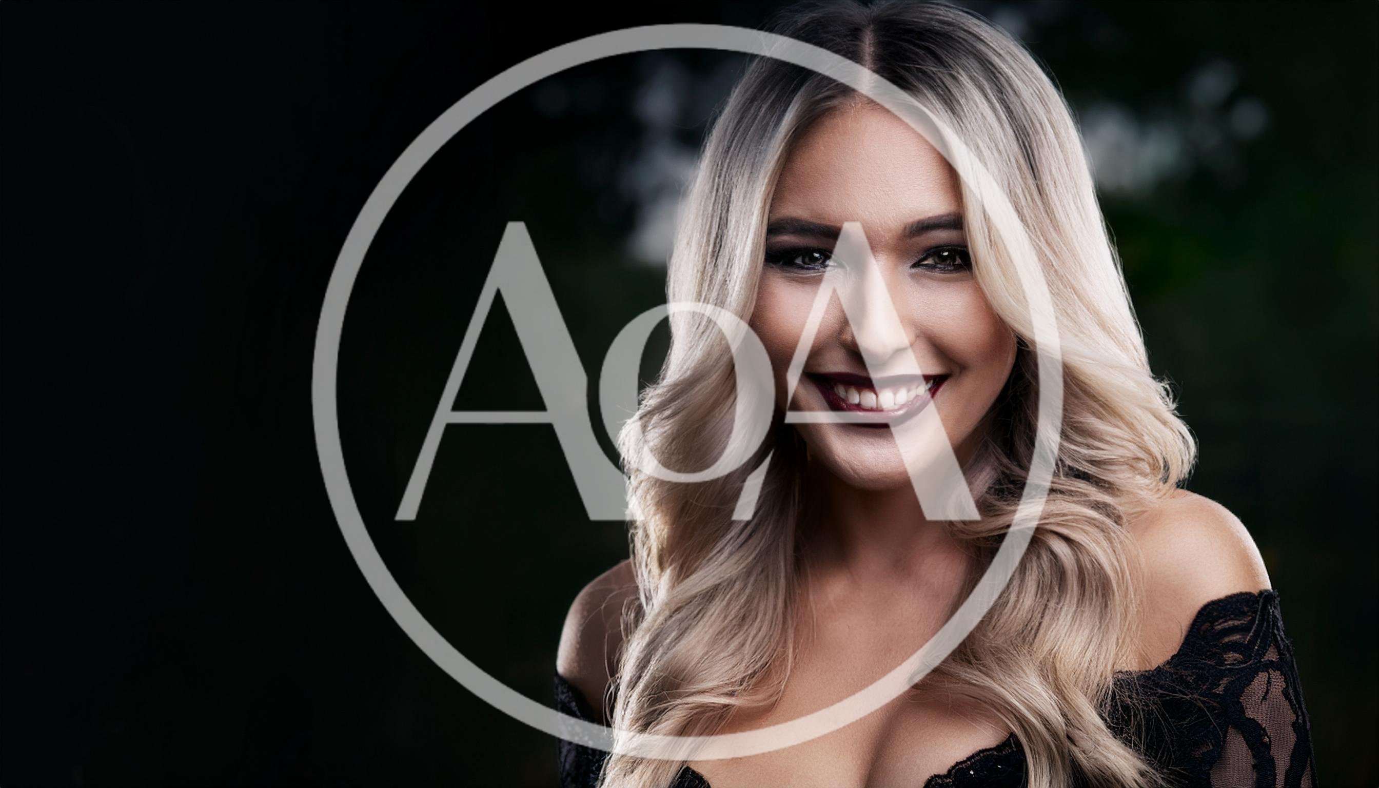 Portrait Of A Smiling Blonde Woman With Dark Lipstick
